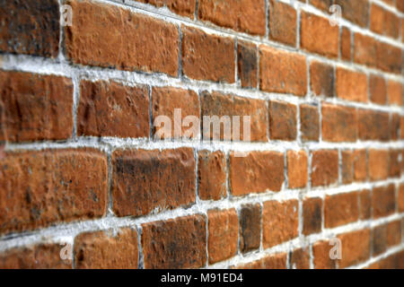 An old brick wall in perspective view Stock Photo