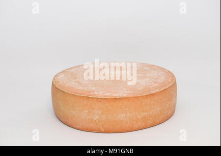 Traditional tete de moine aged mountain cheese of the Alps served with  grapes and walnuts wooden design board with copy space Stock Photo - Alamy