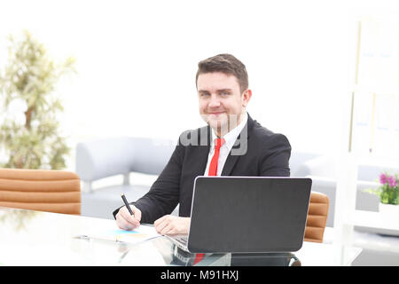 Elegant businessman analyzing data in office Stock Photo
