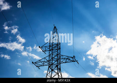Electric pole high voltage isolated on cloudy blue sky Stock Photo