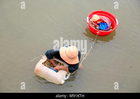 Woman selling seashells on the beach. Phu Quoc. Vietnam. Stock Photo