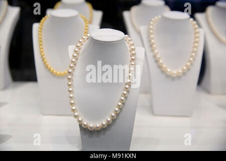Pearl necklaces hanging for sale in shop. Phu Quoc. Vietnam. Stock Photo