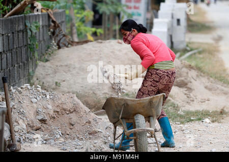 Woman working on construction site.  Bac Son. Vietnam. Stock Photo