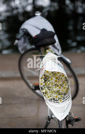 White flowers on a bicycle.  Hanoi. Vietnam. Stock Photo