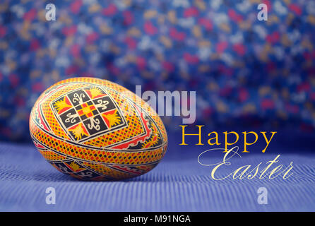 Easter egg painted in beautiful ethnic pattern. Old, traditional handcraft design. Isolated. Close up. Stock Photo
