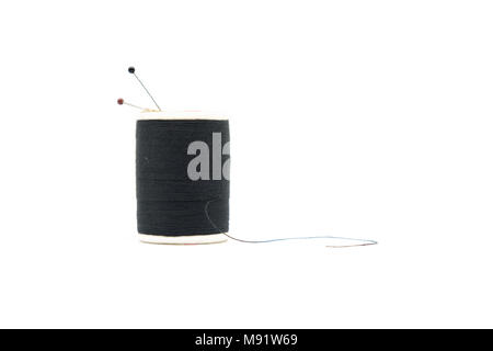 Pin and black thread isolated on white background Stock Photo
