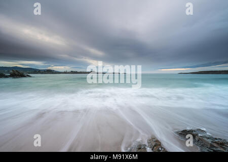 afternoon of clouds on the beach of Arnao Stock Photo