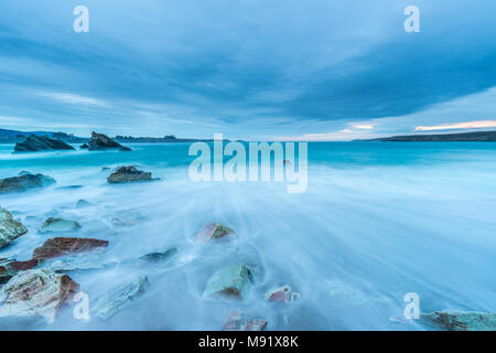 afternoon of clouds on the beach of Arnao Stock Photo