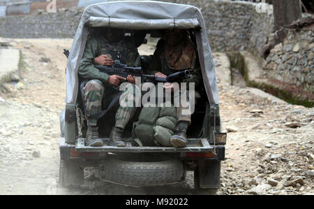 Srinagar, Kashmir. 21st Mar, 2018.Indian Army vehicle arrive on site of gun battle during a gun fight between Government and militants at Halmatpora Kupwara, some 95 km (60 miles) north of Srinagar.Four Indian soldiers and four suspected militants were killed in a gunbattle near the de facto border between India and Pakistan in the disputed region of Kashmir on Wednesday, a senior police official said.©Sofi Suhail/Alamy Live News Stock Photo