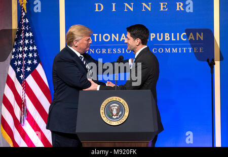 President Donald Trump (L) greets Speaker of the House Paul Ryan, R-WI, as he arrives on stage to delivers remarks at the National Republican Congressional Committee March Dinner at the National Building Museum on March 20, 2018 in Washington, D.C.  Credit: Kevin Dietsch / Pool via CNP /MediaPunch Stock Photo