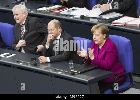 Berlin, Berlin, Germany. 21st Mar, 2018. (R-L) German Chancellor Angela Merkel (CDU), German Minister of Finance, Olaf Scholz of the German Social Democratic Party (SPD), German Minister of the Interior, Homeland and Building, Horst Seehofer of the Christian Social Union (CSU), are seen prior to Merkel's first government declaration during an assembly of the Bundestag (German Parliament) in Berlin, Germany, March 21, 2018. In her speech Chancellor Merkel addressed several issues planned to be dealt with in the upcoming term, the refugees situation in Germany, the Syrian war, the theme of fa Stock Photo