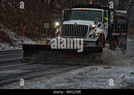 Western Loudoun, USA. 20th Mar, 2018. A VDOT snow plow clears ice, snow and sleet as Fire and Rescue deal with a car crash on route 7 in Bluemont. The first day of spring is looking like the dead of winter as forecast are calling for 5 or more inches of snow by tomorrow.(Photo by Douglas Graham/Loudoun Now) Credit: William Graham/Alamy Live News Stock Photo