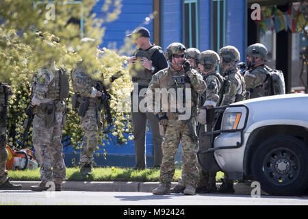 Police SWAT teams secure the Pflugerville, TX, neighborhood around the home of Mark Conditt, who was the suspected serial bomber terrorizing Austin for three weeks. Conditt killed himself earlier in the day during a car chase as officers closed in. Stock Photo