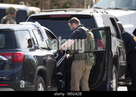 FBI agents help secure the Pflugerville, TX, neighborhood around the home of Mark Conditt, who was the suspected serial bomber terrorizing Austin for three weeks. Conditt killed himself earlier in the day during a car chase as officers closed in. Stock Photo