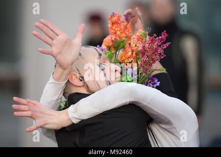 21 March 2018, Germany, Dresden: The dancers Machina Dschurajewa (L) and Alena Worobowa from the Russian theatre ensemble Derevo stand on the post square during a dance performance named 'Zwei Fragen an Gott' (lit. two questions for God). The performance takes place in the course of the event series 'Bach in the city' on the occasion of Johann Sebastian Bach's 333rd birthday. Photo: Carmen Jaspersen/dpa Stock Photo