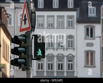 19 March 2018, Germany, Trier: A Karl Marx figure shines on the traffic light. LED technology and stencils were installed for the traffic light close to the soon to be erected Karl Marx statue. Photo: Harald Tittel/dpa