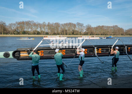 Putney, London, UK. 21 March 2018. Boat Race Practice Outing.  As preparation for the The Cancer Research UK Boat Races on 24 March 2018, the crews participate in Practice Outings.  GV. CUBC Goldie crew manhandle their boat. Credit: Duncan Grove/Alamy Live News Stock Photo