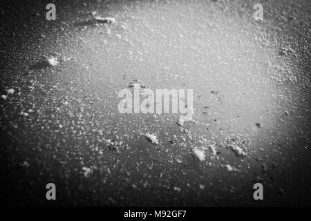 Ice and snow texture, black and white. Abstract background from a natural ice and snow texture, winter theme. Stock Photo
