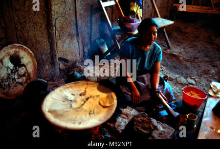 An indigenous Mayan Tzotzil woman makes tortillas in the same way her ancestors did hundreds of years ago. Chiapas State, Mexico. Stock Photo