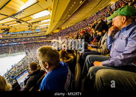 Spectators watching ice hockey game at Madison Square Garden