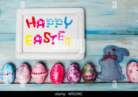 Happy Easter card with creative painted and decorated eggs Stock Photo