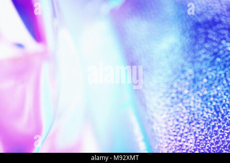 Colorful blurred holographic background in ultraviolet neon trendy colors. Stock Photo