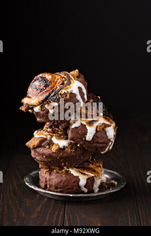 Smores old fashioned fried donuts stack on dark background Stock Photo