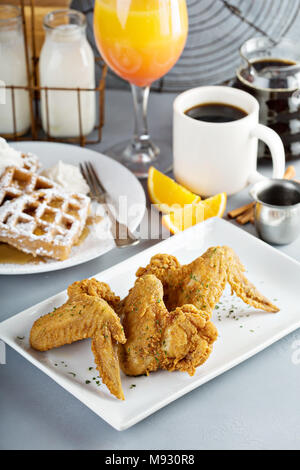 French toast cinnamon waffles with fried chicken Stock Photo