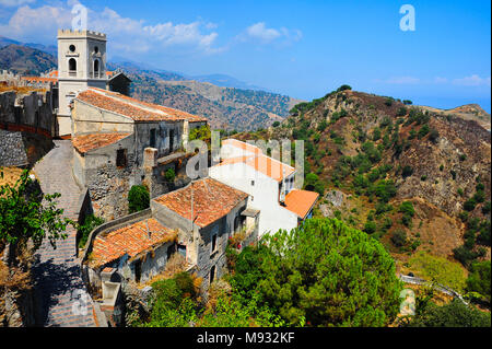 Savoca, Sicily - orange rooftops, stone walls, and Church of St. Nicholas looking to valley below. Setting for many films, most notably the Godfather Stock Photo