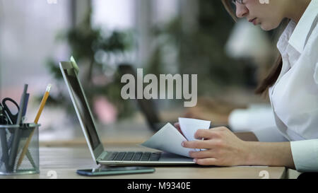 Busy woman checking important documents, analyzing and processing information Stock Photo
