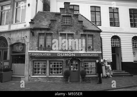 A tiny specialist chocolate shop, Eiermarkt, Brugge, Belgium.  Black and white version Stock Photo