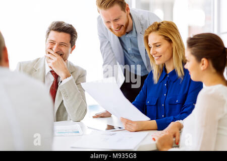 Coworkers working on project together Stock Photo