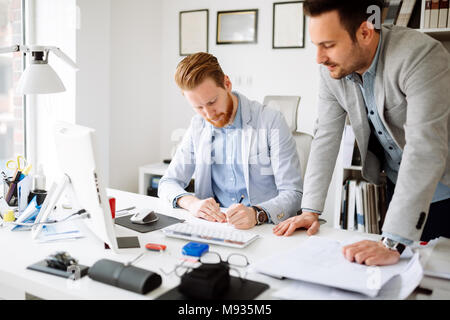 Coworkers planning startup goals Stock Photo