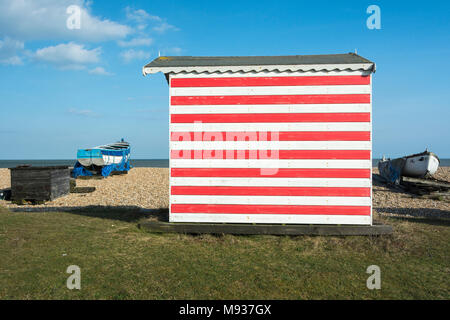 A colourful English seaside beach hut on the coast at New Romney, Kent, England, UK Stock Photo