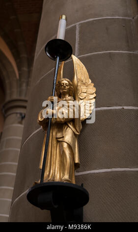 An angel holding a candle in Christ Church Cathedral in Victoria, British Columbia, Canada. Stock Photo