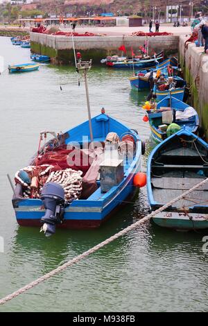 Brightly Coloured Wooden Fishing Boats on the Bou Regreg which separates Rabat and Sale in Morocco Stock Photo