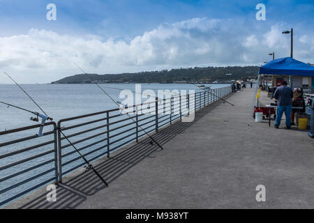 SAN DIEGO, CALIFORNIA, USA - Fishing rods on the pier at Shelter Island in San Diego. Stock Photo