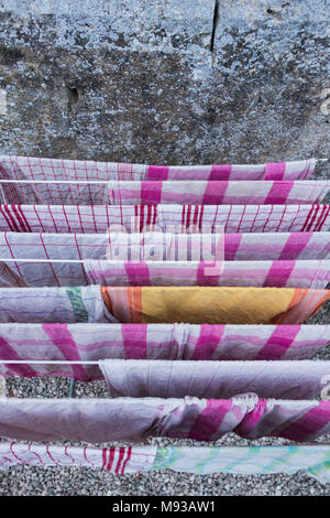 Drying kitchen towels hanged on a clothes horse as seen from above Stock Photo