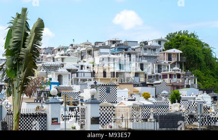 Cemetery of Morne-a-l'eau, Basse-Terre, Guadeloupe, with typical black and white graves all over the hill Stock Photo