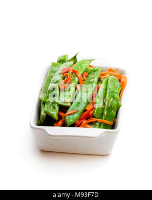 Green  string beans and carrot with spices isolated on white Stock Photo