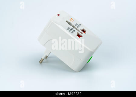 Universal plug adapters for travel around the world isolated on white background. Stock Photo