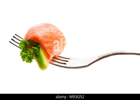 Salmon  piece with avocado on fork isolated on white Stock Photo