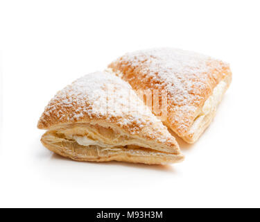 Two  freshly baked turnovers with white cream isolated on white Stock Photo