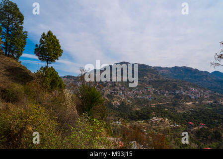 Scenic beautiful mountain landscape valley and town nature with blue sky and clouds in Shimla to Kalka in Himachal Pradesh, North India, India, Asia Stock Photo