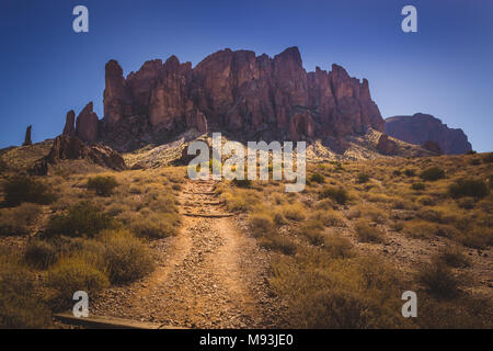Iconic view of Superstition Mountains and Saguaro cacti in Lost Dutchman State Park, Arizona from Treasure Loop Trail Stock Photo
