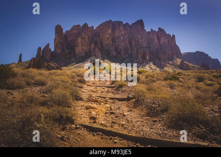 Iconic view of Superstition Mountains and Saguaro cacti in Lost Dutchman State Park, Arizona from Treasure Loop Trail Stock Photo