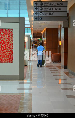 Dubai Airport, UAE - September 22, 2017: Cleaning Personnel in Emirates Business Class Lounge hall Stock Photo