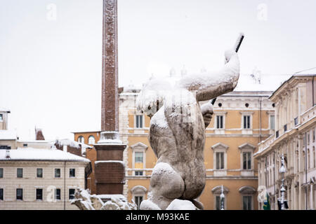the statue of Neptune covered with snow after the unusual snowfall of February 26th 2018 in Rome, Italy Stock Photo