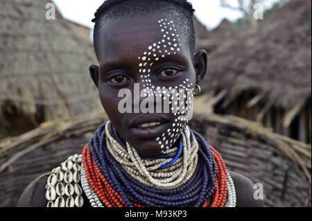 Portrait of a young Karo Tribe Woman with Face Paint and Lots of ...