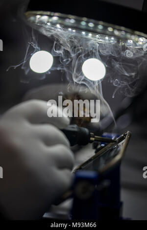 Reparing electronics devices, chips, motherboards, welding Stock Photo